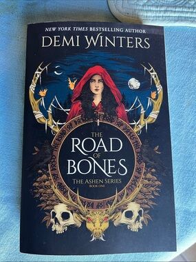 The Road of Bones by Demi Winters - Red Hooded Figure Cover